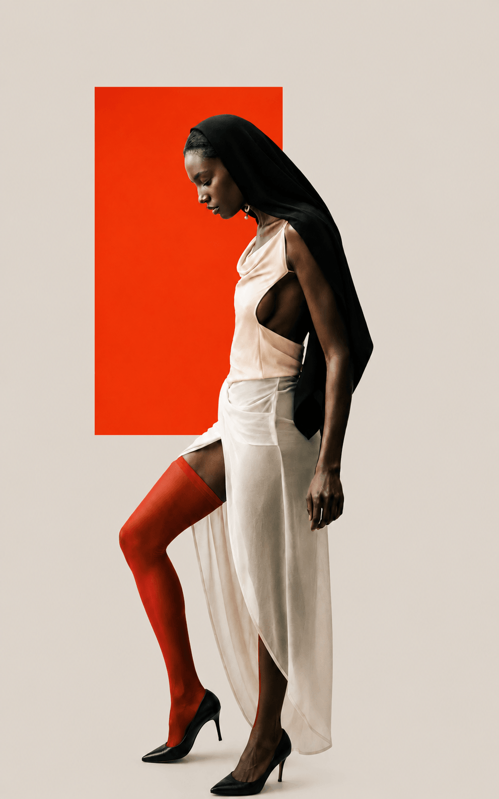 Fashion portrait in profile against a red studio panel, RAW Studio London