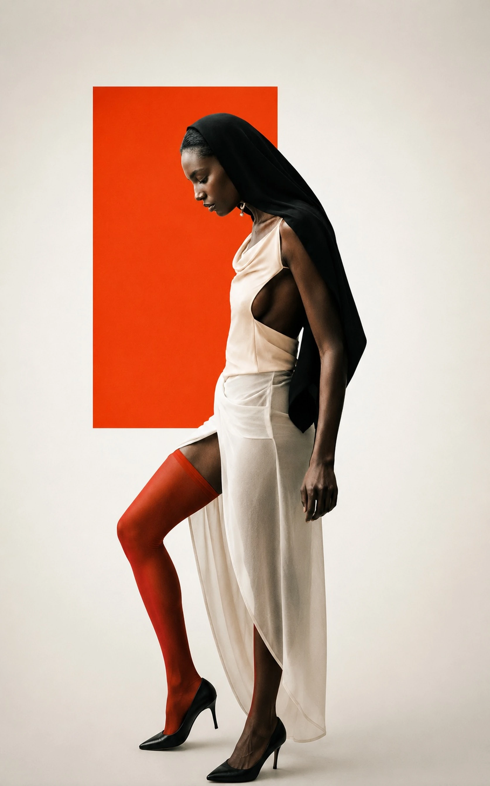Fashion portrait in profile against an orange studio panel, RAW Studio London