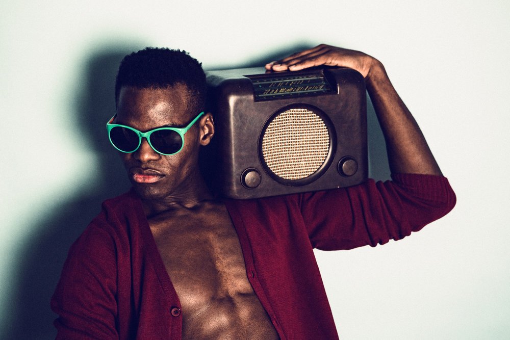 Soweto Red, portrait with a vintage radio, photographed by Buki Koshoni